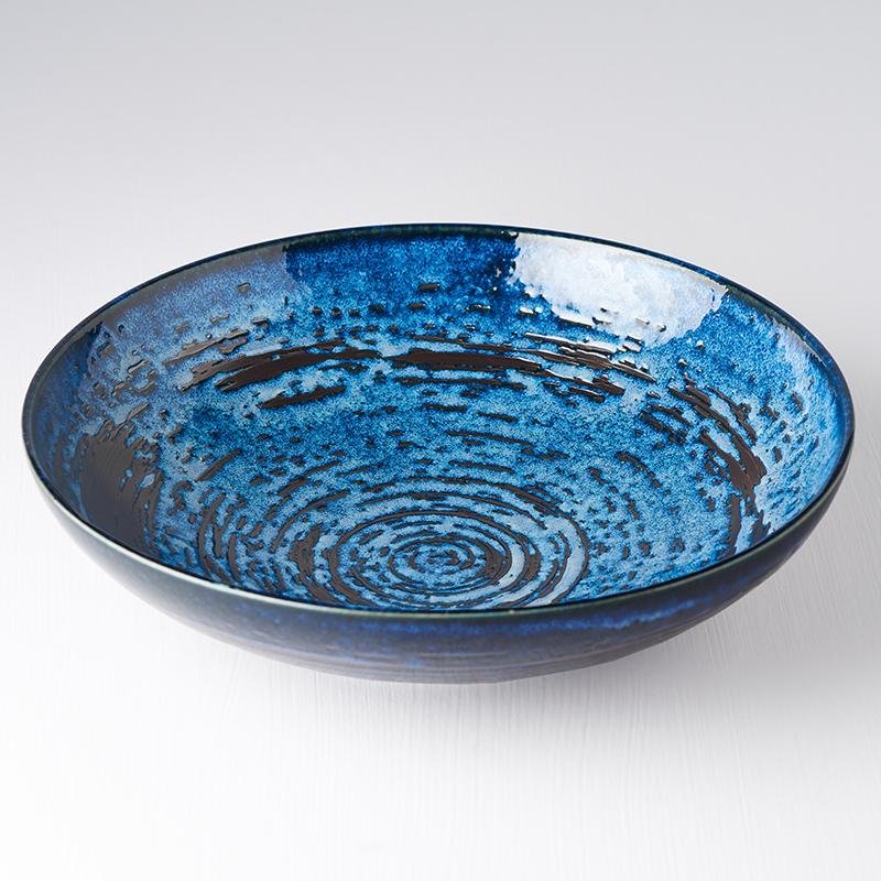 Uneven Serving Bowl Copper Swirl 28cm · €40 · CURATED BY EYEDS